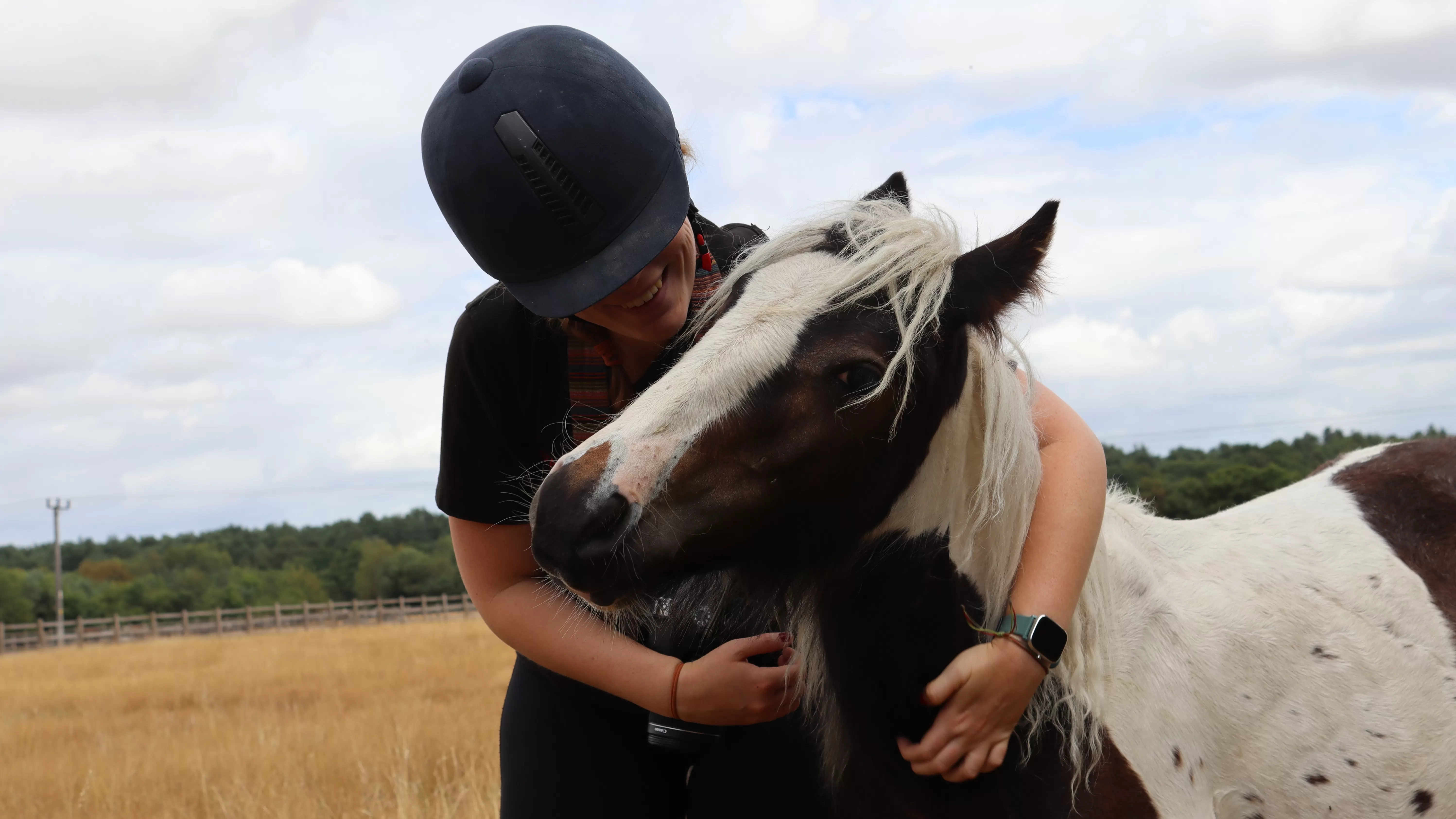 Adoption Star Pickle enjoys a cuddle