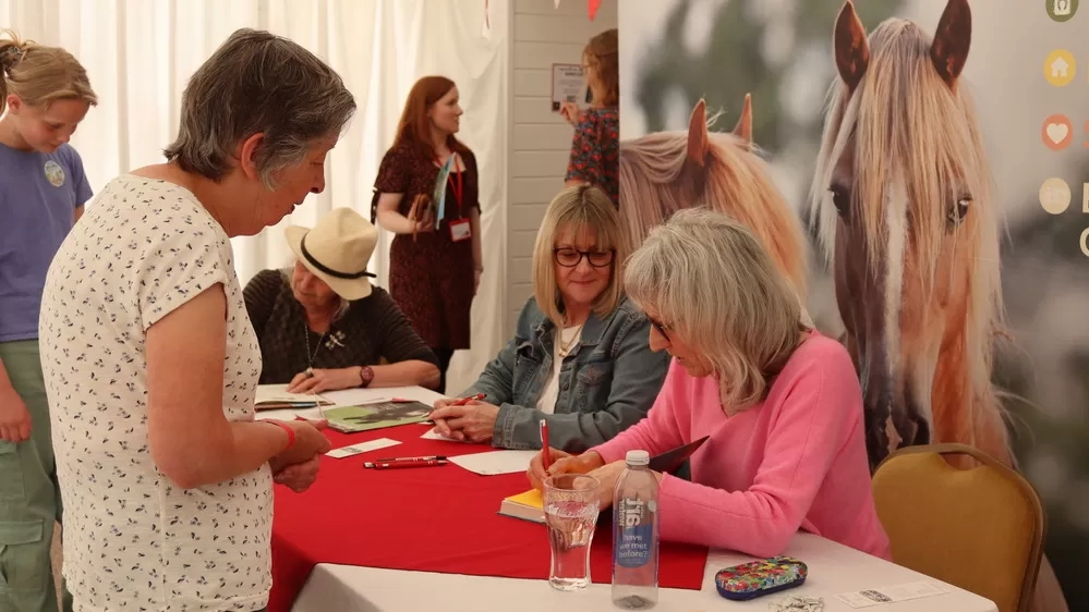 Suzie Fletcher signing books