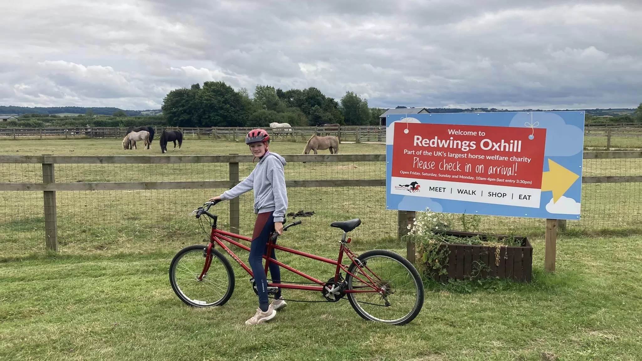 Izzy poses with her tandem bike at Redwings Oxhill