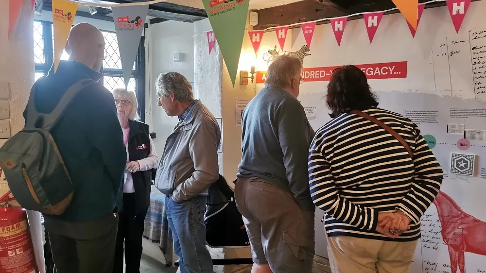 People looks at the displays inside Anna Sewell House.