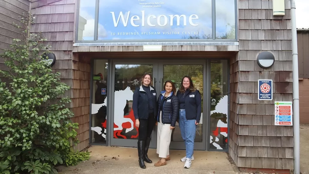 The SEIB team stand outside the entrance to Redwings Aylsham 