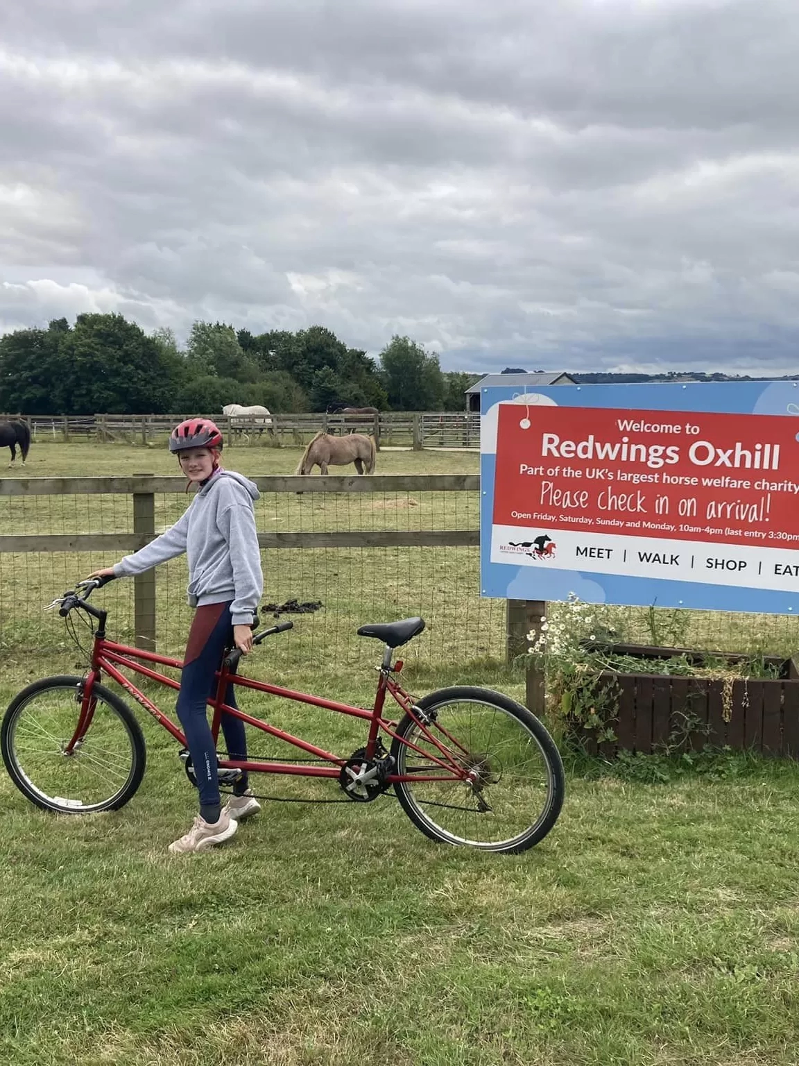 Izzy poses with her tandem bike at Redwings Oxhill